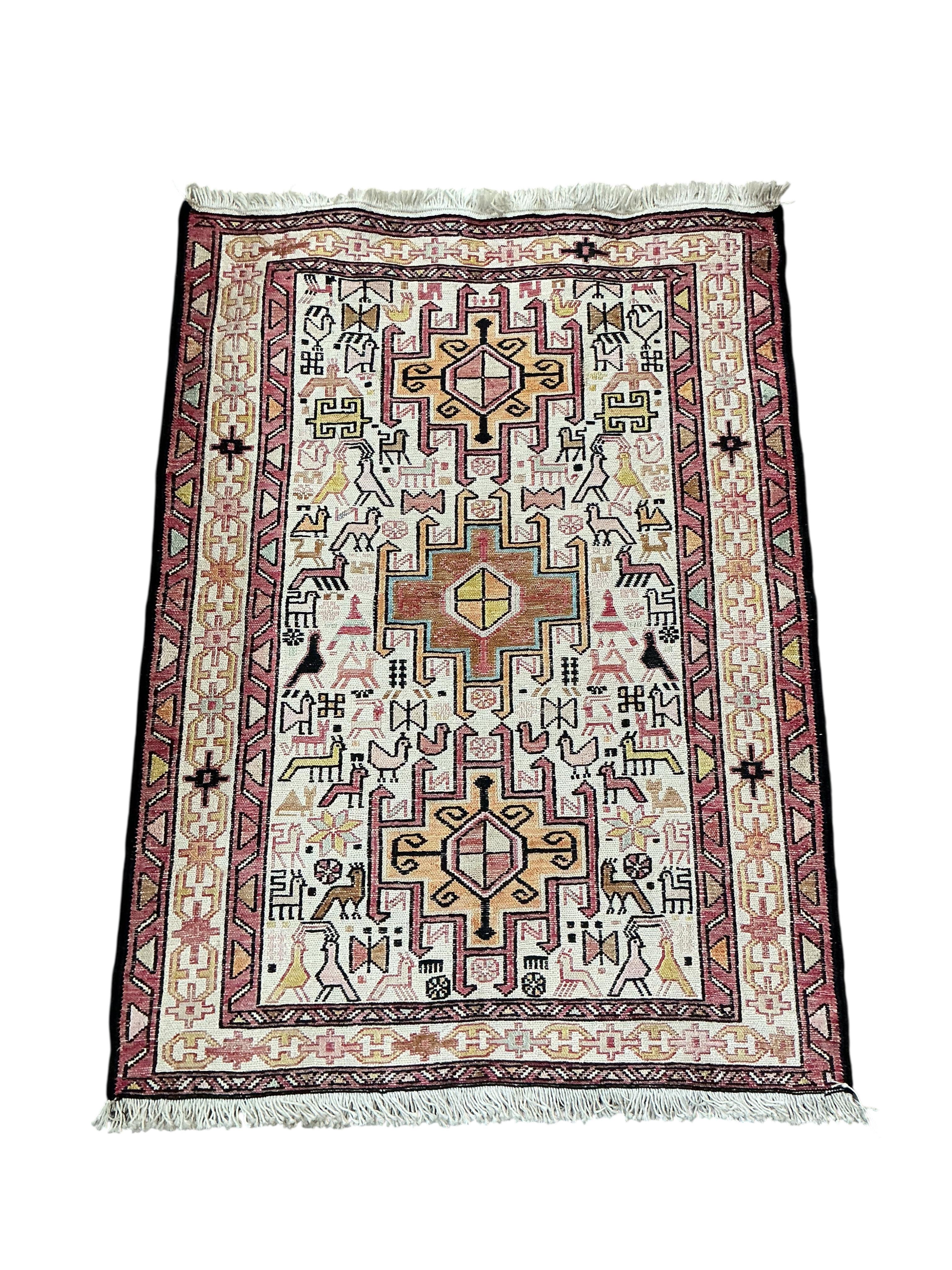 A Soumak ivory ground rug 100 x 72cm
